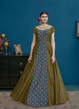 Another Designer Floor Length Suit Is Here In Olive Green And Blue Color Paired With Olive Green Colored Bottom And Dupatta. Its Top Is Fabricated On Art Silk Paired With Santoon Bottom And Chiffon Dupatta. Buy Now.