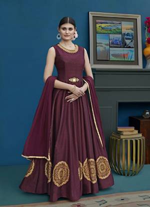 You Will Definitely Earn Lots Of Complimets Wearing This Rich And Elegant Looking Designer Floor Length Suit In Wine Color. Its Top Is Fabricated On Art Silk Paired With Santoon Bottom And Chiffon. Its Color And Fabric Will Give A Rich Look To Your Personality. 