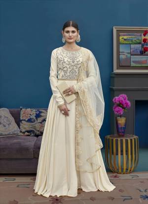 Simple And Elegant Looking Designer Floor Length  Suit Is Here In Cream Color. Its Top Is Fabricated On Art Silk Paired With Santoon Bottom And Net Fabricated Dupatta. Buy This Now.