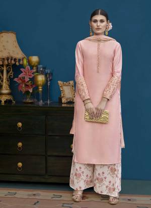 Look Very Pretty In This Designer Plazzo Suit In Light Pink Color Paired With Baby Pink Colored Bottom. This Lovely Suit Is Art Silk Based Paired With Chiffon Dupatta. Its Subtle Color And Rich Fabric Will Earn You Lots Of Compliments From Onlookers. 