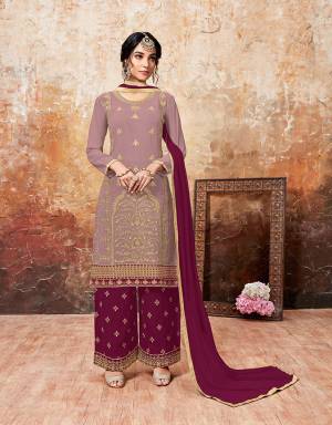 Grab This Beautiful Designer Plazzo Suit With Lovely Color Pallete. Iits top Is In Mauve Color Paired With Magenta Pink Colored Bottom And Dupatta. Its Top And Bottom Are Georgette Based Paired With Chiffon Dupatta. Buy This Semi-Stitched Suit Now.
