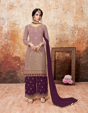 Grab This Beautiful Designer Plazzo Suit With Lovely Color Pallete. Iits top Is In Mauve Color Paired With Purple Colored Bottom And Dupatta. Its Top And Bottom Are Georgette Based Paired With Chiffon Dupatta. Buy This Semi-Stitched Suit Now.