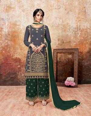 Grab This Beautiful Designer Plazzo Suit With Lovely Color Pallete. Iits top Is In Dark Grey Color Paired With Dark Green Colored Bottom And Dupatta. Its Top And Bottom Are Georgette Based Paired With Chiffon Dupatta. Buy This Semi-Stitched Suit Now.