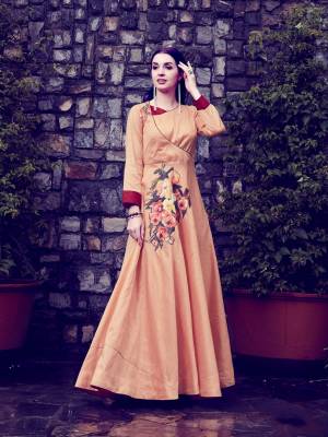 New Yoke Pattern Is Here With This Designer Readymade Long Kurti In Light Orange Color Fabricated On Art Silk. It Has Pretty Floral Patch Work And Available In All Regular Sizes. Buy Now.