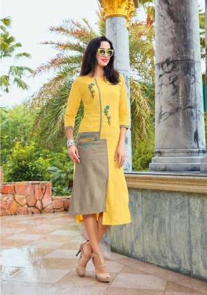 Grab This Beautiful Designer Readymade Kurti In Yellow And Grey Color Fabricated On Linen. It Has Pretty Thread Embroidery Giving It An Attractive Look.