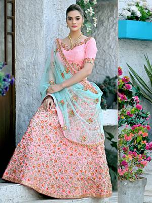 Look Pretty In This Heavy Designer Lehenga Choli In Pink Color Paired With Contrasting Blue Colored Dupatta. This Lehenga Choli Is Rich Silk Based Paired With Net Fabricated Dupatta. This Lehenga Choli Has Pretty Shades In Fabric And Embroidery Which Earn You Lots Of Compliments From Onlookers.