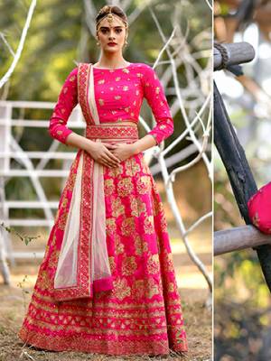 Bright And Visually Appealing Color Is Here With This Heavy Designer Lehenga Choli In Dark Pink Color Paired With Pastel Pink Colored Dupatta. Its Blouse And Lehenga Are Fabricated On Art Silk Paired With Net Fabricated Dupatta. It Is Beautified With Heavy Jari Embroidery All Over It. 