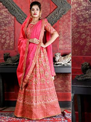 Bright And Visually Appealing Color Is Here With This Heavy Designer Lehenga Choli In Dark Pink Color. Its Blouse And Lehenga Are Fabricated On Art Silk Paired With Net Fabricated Dupatta. It Is Beautified With Heavy Jari Embroidery All Over It. 