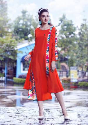 Shine Bright Wearing This Readymade Kurti In Orange Color Which Is Silk Based Beautified With Prints. 
