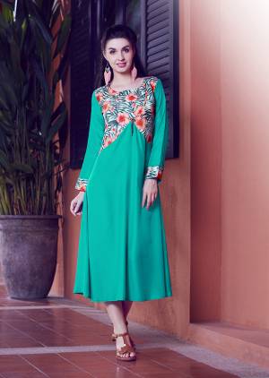 Shine Bright Wearing This Readymade Kurti In Sea Green Color Which Is Silk Based Beautified With Prints. 