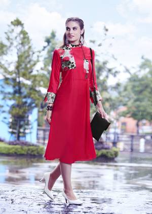 Enhance Your Personality Wearing This Readymade Kurti In Red Color Fabricated on Modal Silk Beautified With Prints. 