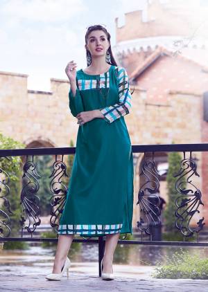 Pretty Elegant Looking Readymade Kurti Is Here In Teal Blue Color Fabricated On Modal Silk Beautified With Prints. 