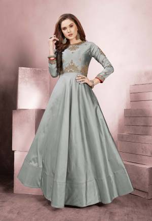 Flaunt Your Rich And Elegant Taste Wearing This Designer Readymade Gown In Grey Color On Rich Silk Based Fabric. This Gown Is Light Weight, Durable And Easy To Carry Through Out The Gala. Buy Now.
