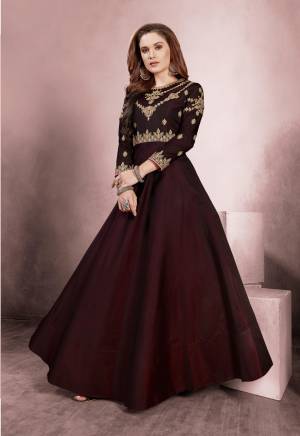Royal Looking Designer Floor Length Gown Is Here In Brown Color Based On Silk Fabric. This Readymade Gown Is Available In All Regular Sizes. 