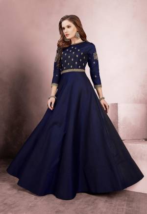 Celebrate This Festive Season Wearing This Designer Floor Length Readymade Gown In Navy Blue Color Fabricated On Tafeta Silk. It Is Beautified With Heavy Embroidery Over The Yoke And Sleeves. 
