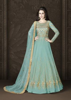 Grab This Amazing Designer Floor Length Suit In A Very Trendy Shade In Turquoise Blue Color. Its Heavy Embroidered Top Is Fabricated On Net Paired With Art Silk Bottom and Net Dupatta. This Suit Ensures Superb Comfort All Day Long. 