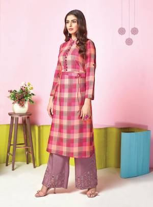 Look Pretty In This Pretty Pink Colored Kurti Paired With Contrasting Mauve Colored Plazzo. This Pretty Set Is Muslin Based Beautified With Prints And Thread Work. It Is Light In Weight And Easy To Carry All Day Long. 