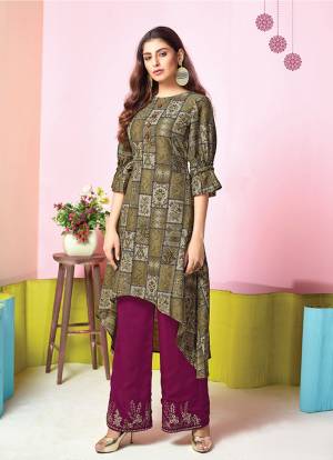 For A Simple And Elegant Festive Look, Grab This Designer Readymade Kurti And Plazzo Set In Olive Green Colored Top Paired With Contrasting Magenta Pink Colored Plazzo. This Set Is Fabricated On Muslin Beautified With Prints And Thread Work. Buy Now.