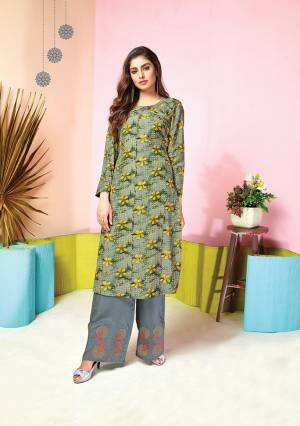 Grab This Pretty Designer Pair Of Kurti In Grey And Yellow Colored Top Paired With Grey colored Bottom. Its Top And Bottom Are Fabricated On Muslin Beautified With Prints And Thread Work. It Is Available In All Regular Sizes. 