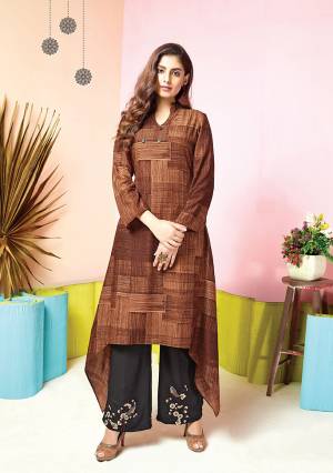 For Your Semi-Casual Wear, Grab This Pretty Set Of Kurti And Plazzo In Brown Colored Kurti Paired With Black Colored Plazzo. Its Top And Bottom Are Fabricated On Muslin Beautified With Prints And Thread Work. 