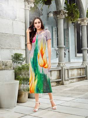 Go Colorful In This Multi Colored Readymade Kurti Fabricated On Linen. It Is Beautified With Bold Prints. Also It Is Soft Towards Skin And Easy To Carry All Day Long. 