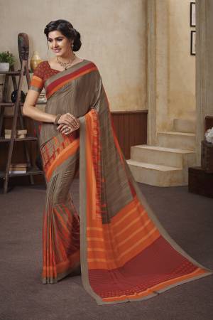 Add This Beautiful Saree To Your Wardrobe For Your Casuals Or Semi-Casual Wear. This Saree And Blouse Are Crepe Based Beautified With Prints. Grab It Now.