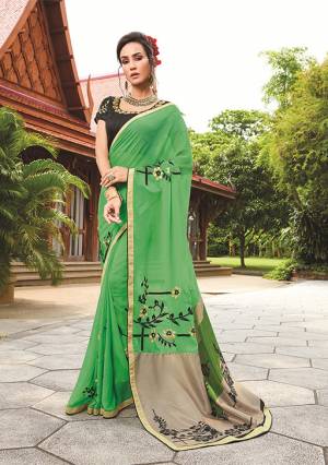Simple And Elegant Looking Designer Saree Is Here In Green Color Paired With Black Colored Blouse, This Saree Is Fabricated On Georgette Paired With Art Silk Fabricated Blouse. It Has Prints And Thread Embroidery. 
