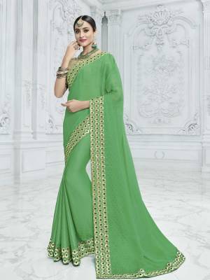 Gorgeously mesmerizing is what you will look at the next wedding gala wearing this beautiful green color two tone chiffon pattern saree. Ideal for party, festive & social gatherings. this gorgeous saree featuring a beautiful mix of designs. Its attractive color and designer heavy embroidered design, designer beautiful heavy blouse, beautiful floral design work over the attire & contrast hemline adds to the look. Comes along with a contrast unstitched blouse.