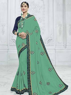 Look your ethnic best by wearing this Sea green color silk fabrics saree. Ideal for party, festive & social gatherings. this gorgeous saree featuring a beautiful mix of designs. Its attractive color and designer heavy embroidered design, designer beautiful heavy blouse, beautiful floral design work over the attire & contrast hemline adds to the look. Comes along with a contrast unstitched blouse.