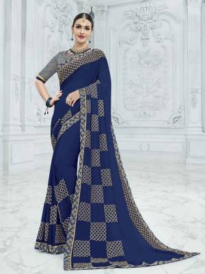 The fabulous pattern makes this saree a classy number to be included in your wardrobe. Navy Blue color georgette saree. Ideal for party, festive & social gatherings. this gorgeous saree featuring a beautiful mix of designs. Its attractive color and designer heavy embroidered design, designer beautiful heavy blouse, stone design, beautiful floral design work over the attire & contrast hemline adds to the look. Comes along with a contrast unstitched blouse.