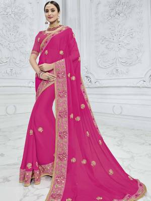 Wear this Fuschia  pink color moss chiffon saree. Ideal for party, festive & social gatherings. this gorgeous saree featuring a beautiful mix of designs. Its attractive color and designer heavy embroidered design, Flower embroidered patch design, stone design, beautiful floral design work over the attire & contrast hemline adds to the look. Comes along with a contrast unstitched blouse.