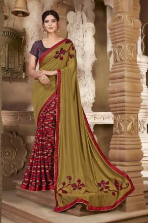 Add This Pretty Color Pallete With This Designer Saree In Pear Green And Purple Color Paired With Purple Colored Blouse. This Saree And Blouse Are Silk Based Beautified With Prints And Patch Work. 