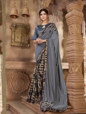 Flaunt Your Rich And Elegant Taste Wearing This Designer Saree In Grey Color Paired With  Grey Colored Blouse. It Is Rich Silk Based Which Gives A Rich And Elegant Look To Your Personality. 