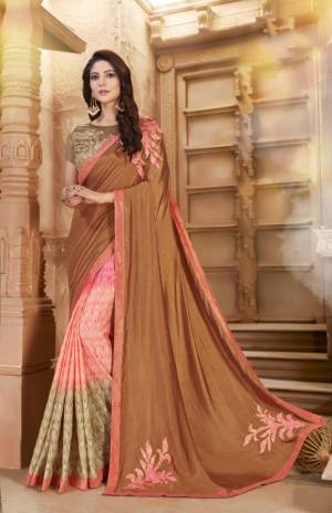 Look Pretty Wearing This Designer Saree In Pretty Color Pallete. This Saree Is In Shades Of Light Brown And Pink Paired With Beige Colored Blouse. It Is Fabricated on Art Silk Which Also Give A Rich Look To Your Personality. 