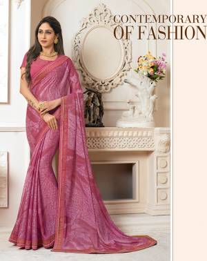 Look Pretty In This Pink Colored Saree Paired With Pink Colored Blouse. This Saree Is Fabricated On Georgette Chiffon Paired With Art Silk Fabricated Blouse. It Is Beautified With Prints And Stone Work. 
