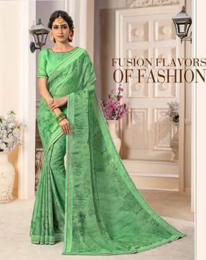 Celebrate This Festive In Traditional Color Pallete With This Saree In Light Green Color Paired With Light Green Colored Blouse. This Saree Is Fabricated On Georgette Chiffon Paired With Art Silk Fabricated Blouse.  