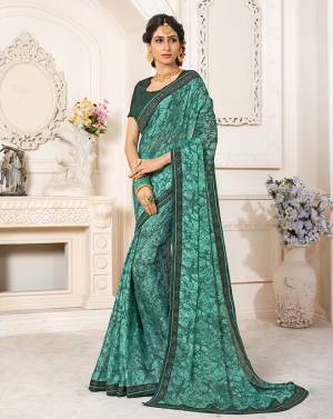 Here Is A Beautiful Designer Teal Green Colored Saree Paired With Teal Green Colored Blouse. This Saree Is Fabricated On Georgette Chiffon Paired With Art Silk Fabricated Blouse. It Is Light In Weight And Easy To Carry All Day Long. Buy Now.