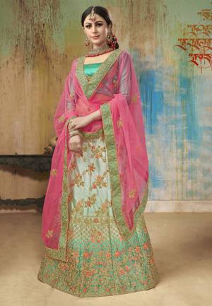 Grab This Beautiful Heavy Designer Lehenga Choli In Shades Of Green. Its Blouse Is In Green Color Paired With Light Green Colored Lehenga And Contrasting Rani Pink Colored Dupatta. This Lehenga Choli Is Fabricated On Satin Silk Paired With Net Fabricated Blouse. Buy Now.