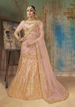Very Pretty Shade In Pink Is Here With This Heavy Designer Lehenga Choli In Blush Pink Color. It Blouse And Lehenga Are Fabricated On Satin Silk Paired With Net Fabricated Dupatta. This Heavy Embroidered Lehenga Choli Ensures Superb Comfort All Day Long. 