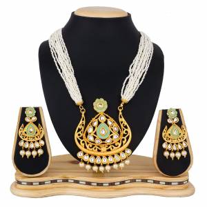Here Is A Heavy Designer Necklace Set In Golden Color. This Necklace Set Can Be Paired With Any Colored Traditional Attire. Buy Now.