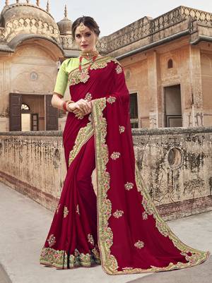 For A Royal Look, Grab This Designer Saree In Maroon Color Paired With Contrasting Light Green Colored Blouse. This Saree Is Fabricated On Georgette paired With Art Silk Fabricated Blouse. It Is Light In Weight And Ensures Superb Comfort All Day Long. 