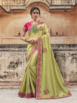 Celebrate This Festive Season Wearing This Designer Saree In Pear Green Color Paired With Contrasting Fuschia Pink Colored Blouse. This Lovely Saree Is Fabricated On Silk Georgette Paired with Art Silk Fabricated Blouse Which Gives A Rich Look To Your Personality. 