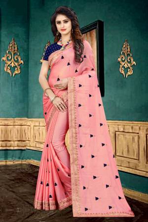 Look Pretty In This Designer Pink Colored Saree Paired With Contrasting Navy Blue Colored Blouse. This Saree Is Fabricated On Georgette Paired With Brocade Fabricated Blouse. It Is Beautified With Butti Work All Over The Saree. 