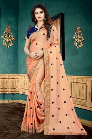 Look Pretty In This Designer Peach  Colored Saree Paired With Contrasting Navy Blue Colored Blouse. This Saree Is Fabricated On Georgette Paired With Brocade Fabricated Blouse. It Is Beautified With Butti Work All Over The Saree. 