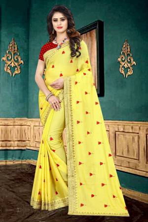 Celebrate This Festive Season With Beauty And Comfort Wearing This Designer Saree In Yellow Color Paired With Contrasting Red Colored Blouse. This Saree Is Georgette Based Paired With Brocade Fabricated Blouse. It Is Light In Weight And Easy To Carry All Day Long. 