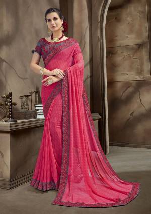 Look Beautiful Wearing This Bright Dark Pink Colored Saree Paired With Contrasting Navy Blue Colored Blouse. This Saree IS Georgette Based Paired With Art Silk Fabricated Blouse. 