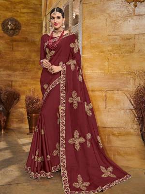 Wear this maroon color two tone bright georgette saree. Ideal for party, festive & social gatherings. this gorgeous saree featuring a beautiful mix of designs. Its attractive color and heavy designer embroidered saree, full saree design saree, beautiful floral design all over work over the attire & contrast hemline adds to the look. Comes along with a contrast unstitched blouse.