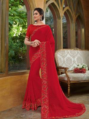 Look gorgeous in this beautiful printed red color georgette saree. Ideal for party, festive & social gatherings. this gorgeous saree featuring a beautiful mix of designs. Its attractive color and heavy designer embroidered saree, stone design, sequence designs, beautiful floral design all over work over the attire & contrast hemline adds to the look. Comes along with a contrast unstitched blouse.