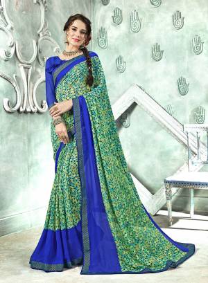 Add Some Casuals With This Saree In Green Color Paired With Contrasting Royal Blue Colored Blouse. This Saree And Blouse Are Georgette Based Beautified With prints All Over. Buy Now.