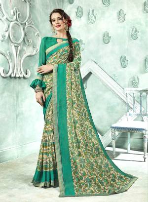 Here Is A Pretty Green Colored Printed Saree Paired With Green Colored Blouse. This Saree And Blouse Are Fabricated On Georgette Which Is Light In Weight And Easy To Carry All Day Long. 
